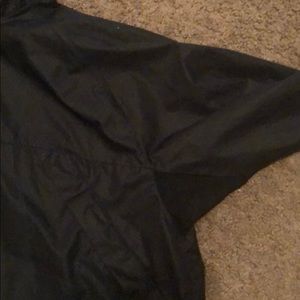 Black windbreak with a pocket in the back